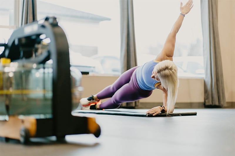 woman practicing yoga at CoreFit Training Studio